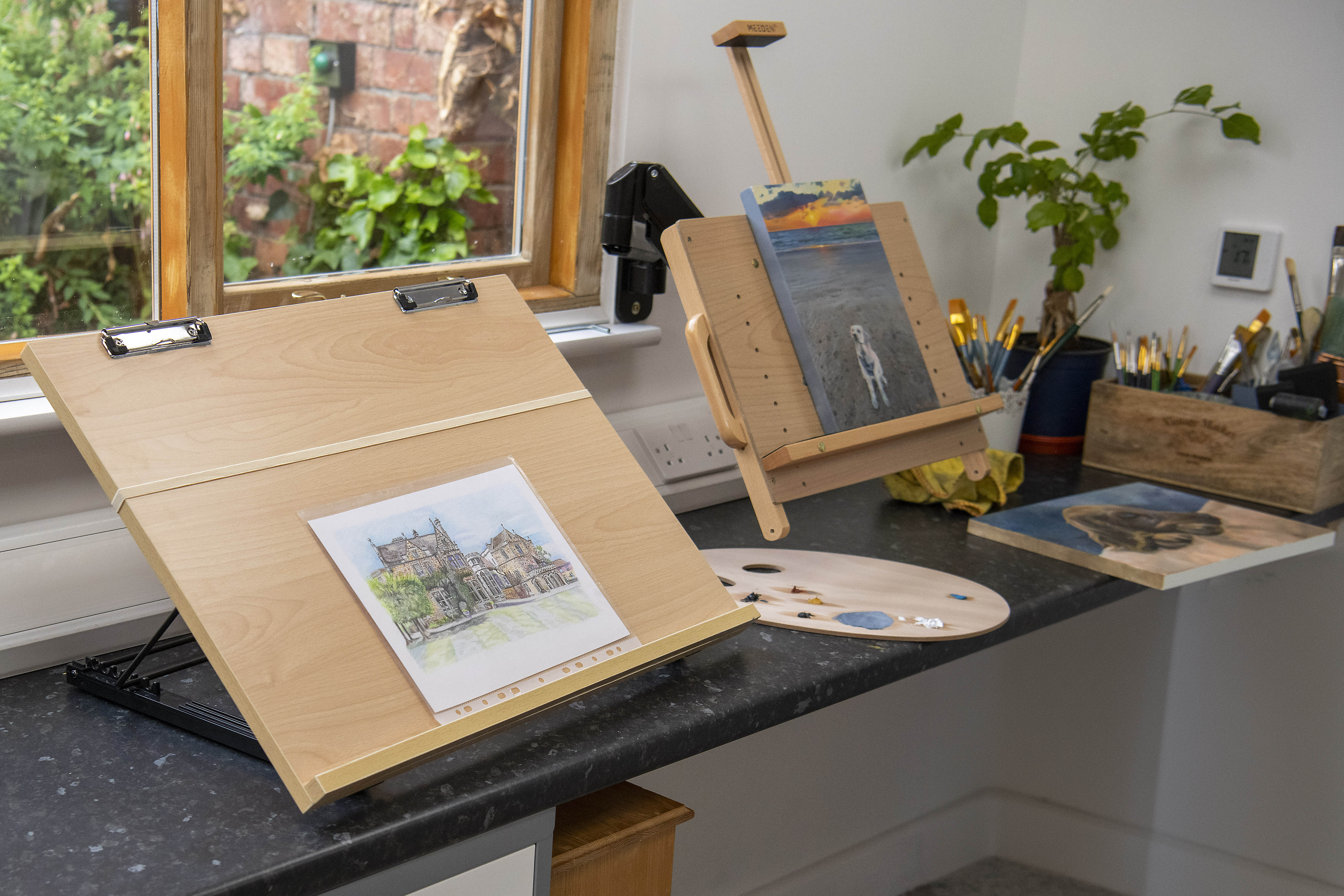 Paintings on easels in Alex Lockhart's studio